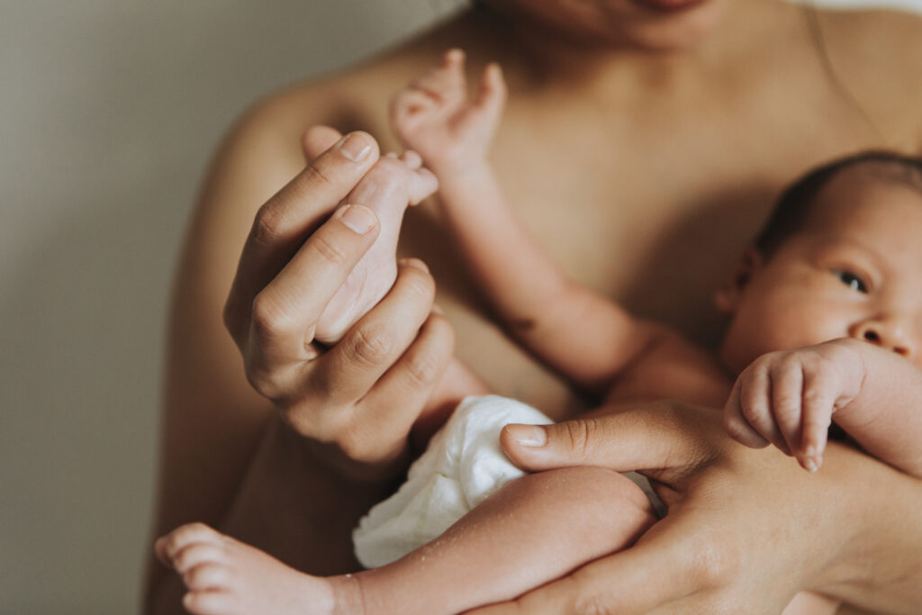 Loving mother holding her baby - A heartwarming and tender family moment.